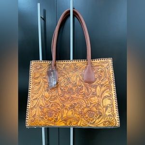 Juan Antonio punched leather bag NWT